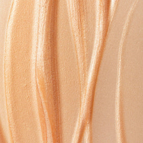 Summer Fridays product on model's cheek with glass skin effect, illustrates dewy finish