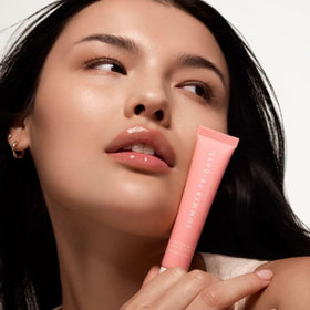Summer Fridays swatch on skin displaying sheer pink color and dewy look