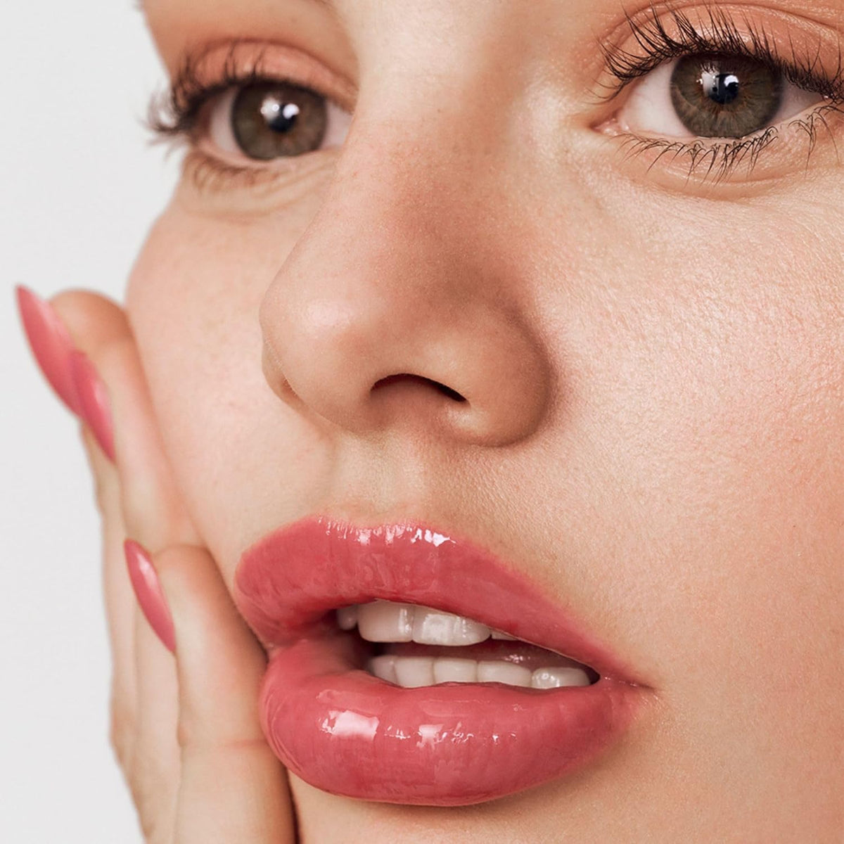 Summer Fridays swatches on skin showing sheer pink guava color payoff