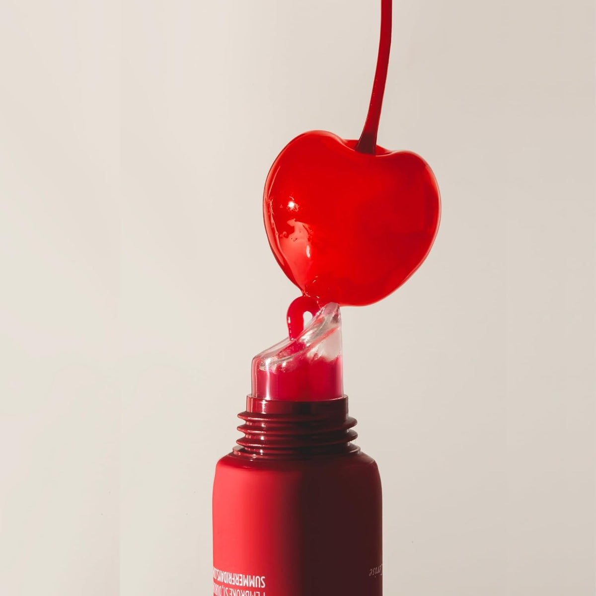 Summer Fridays close-up of cherry tint on applicator showing buildable sheer color