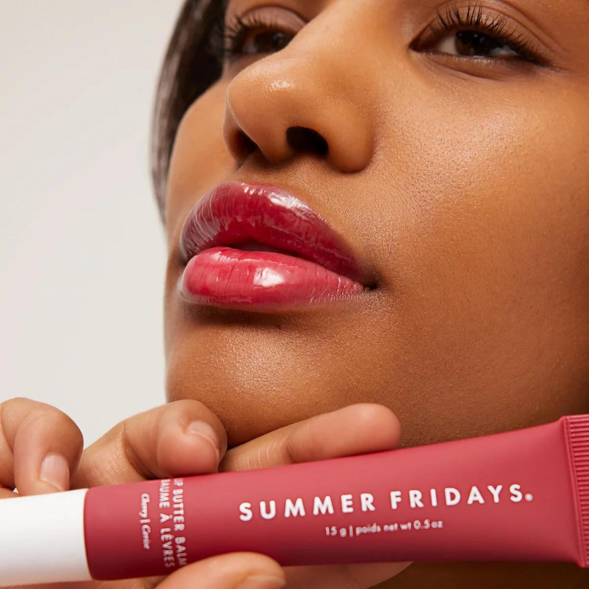 Summer Fridays balm swiped on lips showing glossy cherry tint and healthy look