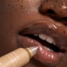Summer Fridays balms on nightstand and in purse, shows everyday accessibility