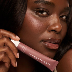 Summer Fridays open tube revealing smooth balm surface and applicator