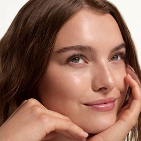 Summer Fridays application on cheek with fingers showing even, skin-like coverage benefit