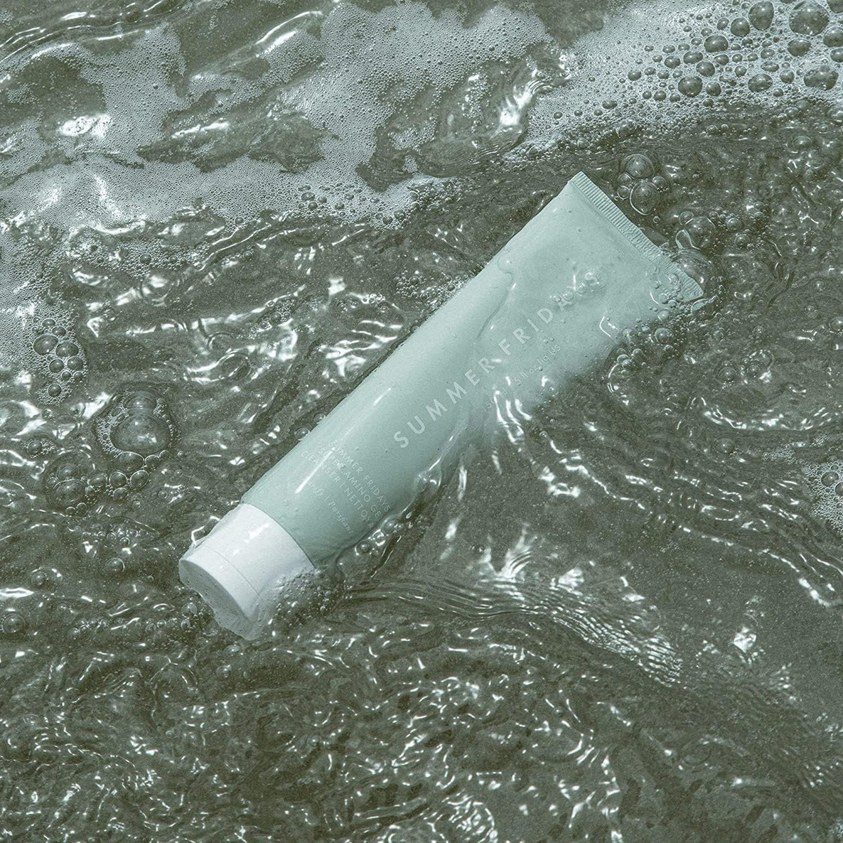 Summer Fridays cleanser placed on bathroom shelf showing routine use