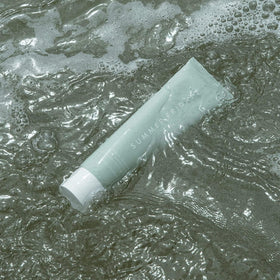 Summer Fridays cleanser placed on bathroom shelf showing routine use