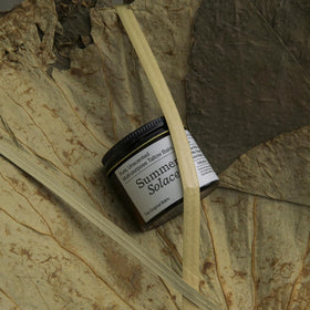 Summer Solace next to a ruler to show the 60ml size and compact, economical portioning benefit