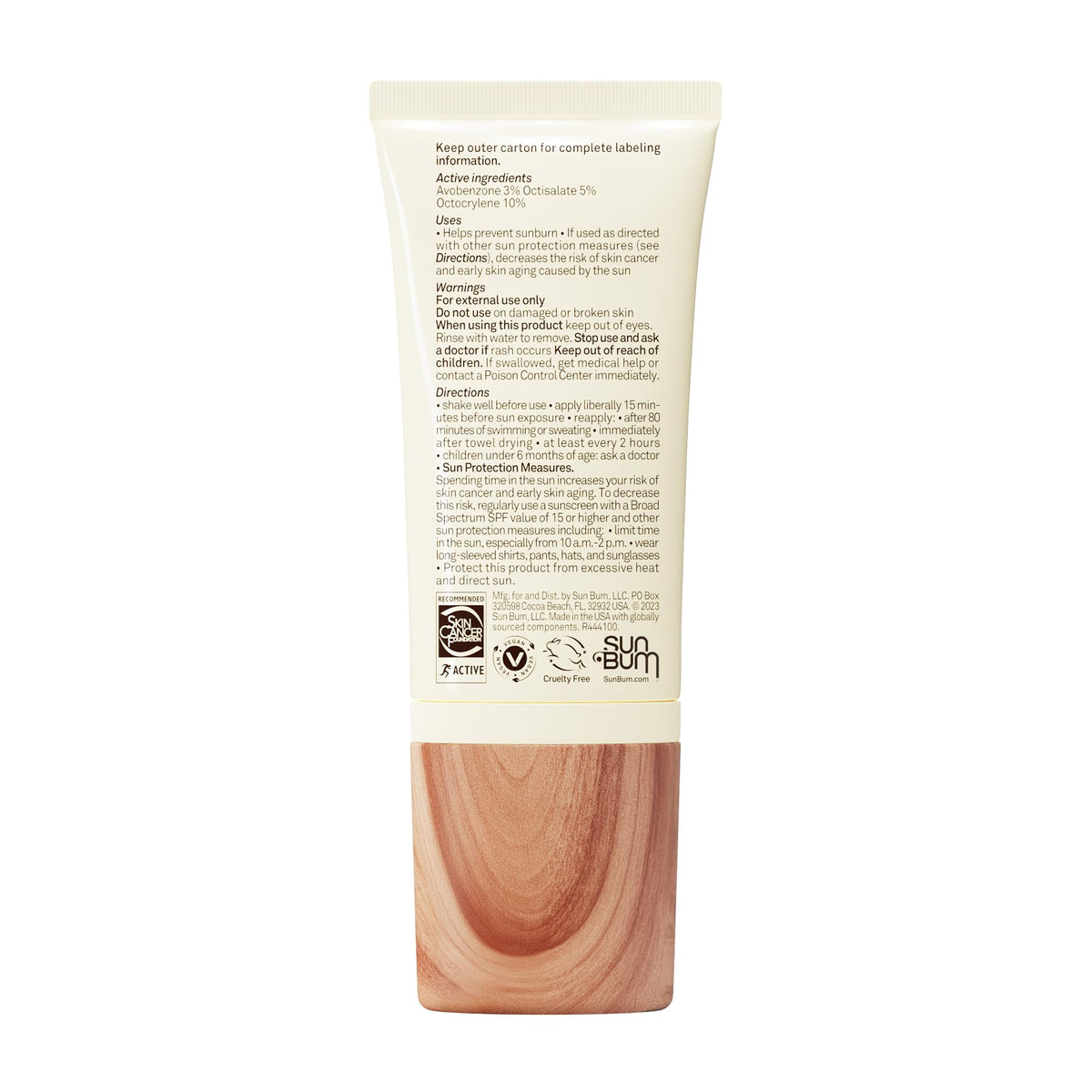 Sun Bum tube on beach towel showing travel-ready sun protection benefit