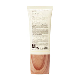 Sun Bum tube on beach towel showing travel-ready sun protection benefit