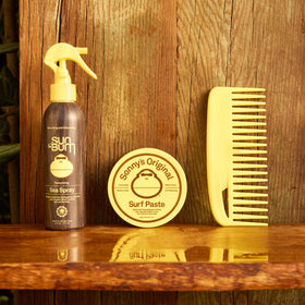Sun Bum 3 oz jar held in hand showing compact travel-friendly size
