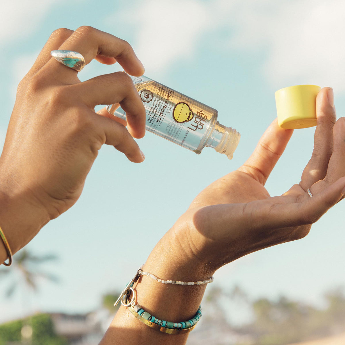 Sun Bum oil texture closeup showing silky consistency and quick absorption