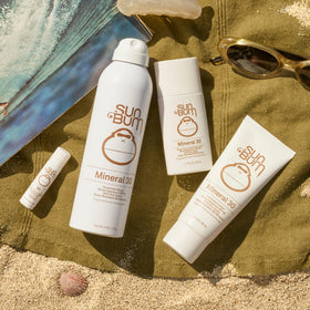 Sun Bum travel bottle in hand demonstrating compact, portable protection