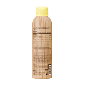 Sun Bum bottle held in hand to show 6 oz size and portability