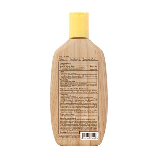 Sun Bum sunscreen bottle on sandy beach showing outdoor-ready, reef-friendly benefit