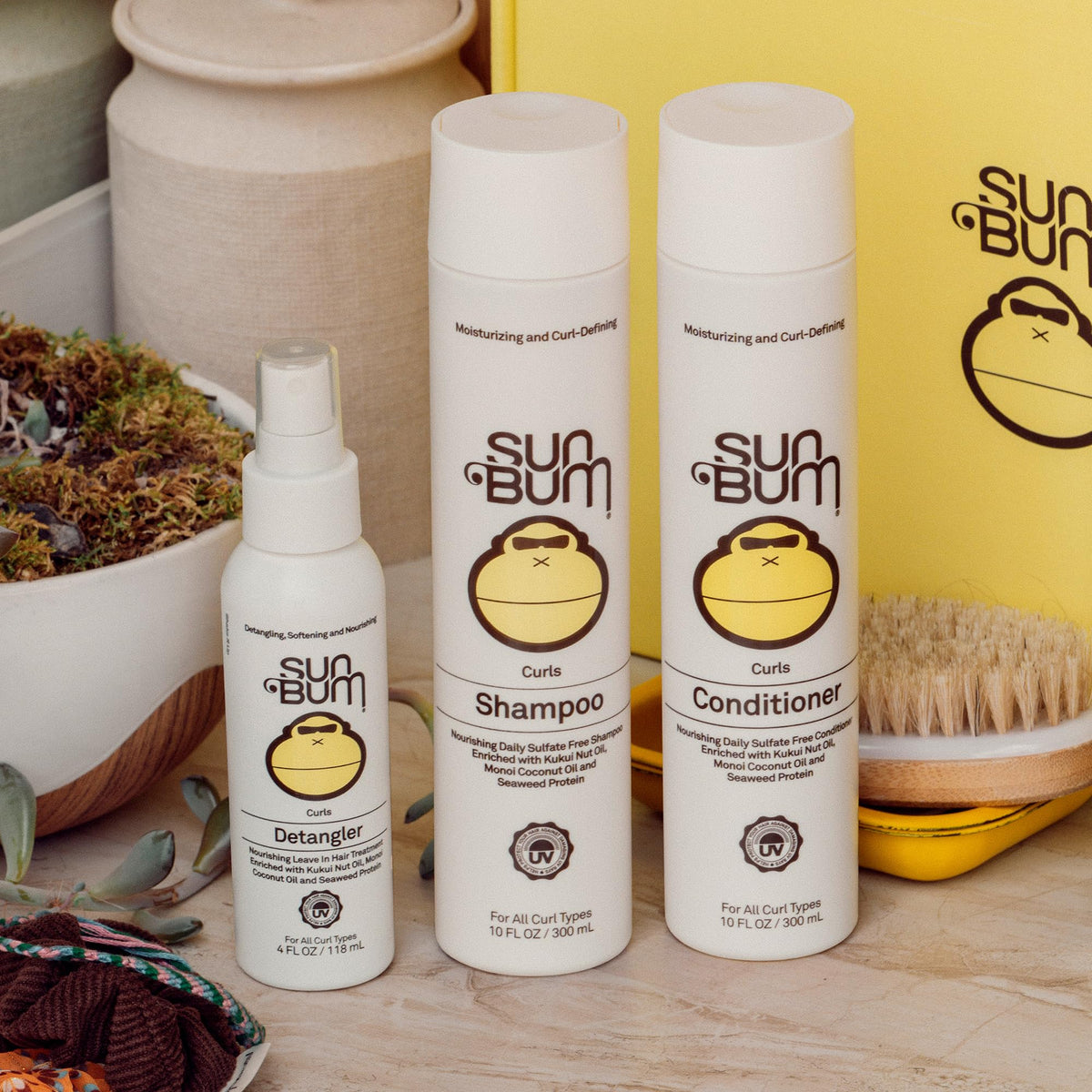Sun Bum detangler applied to wavy hair showing smoother texture and shine