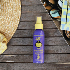 Sun Bum mist on blonde hair texture showing smoother frizz control and shine