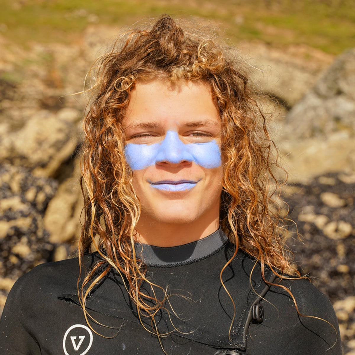 Sun Zapper applying on nose illustrating targeted protection during surf