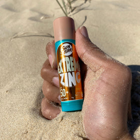 Sun Zapper inside surf bag with board gear highlighting portability benefit