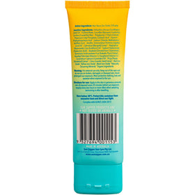 Sun Zapper tube in beach scene showing reef-safe sunscreen for ocean use