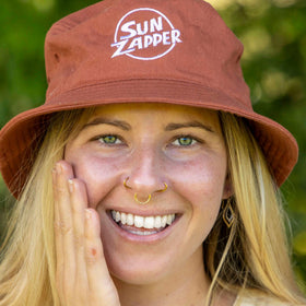 Sun Zapper tube open with sunscreen dispensed showing easy application