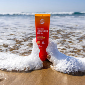 Sun Zapper travel size next to sunglasses showing carry-on friendly convenience