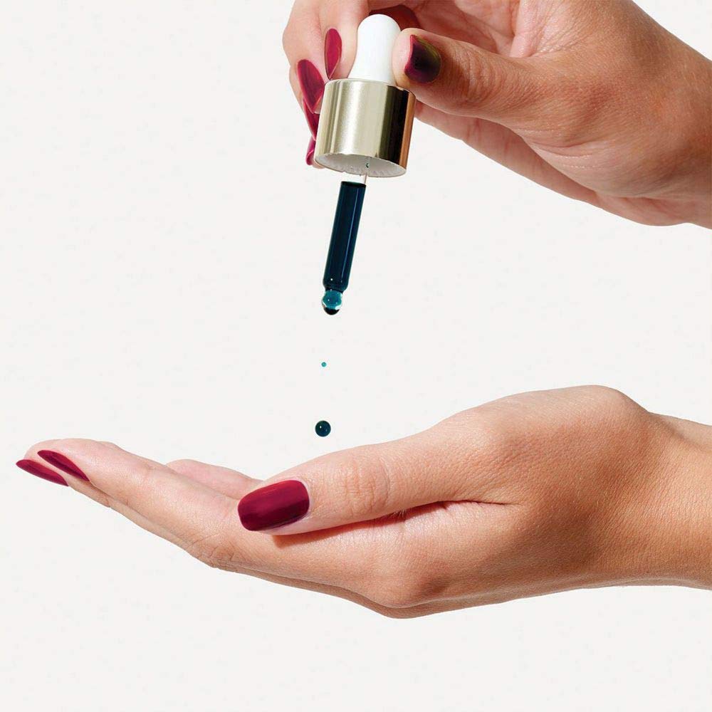 Sunday Riley Luna oil texture close-up, highlighting lightweight, hydrating finish