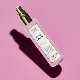 Sunday Riley Pink Drink mist spraying onto skin for instant hydration boost