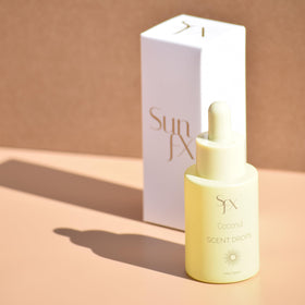 SunFX Coconut dropper close-up showing controlled drop dispensing for precise scent dosing