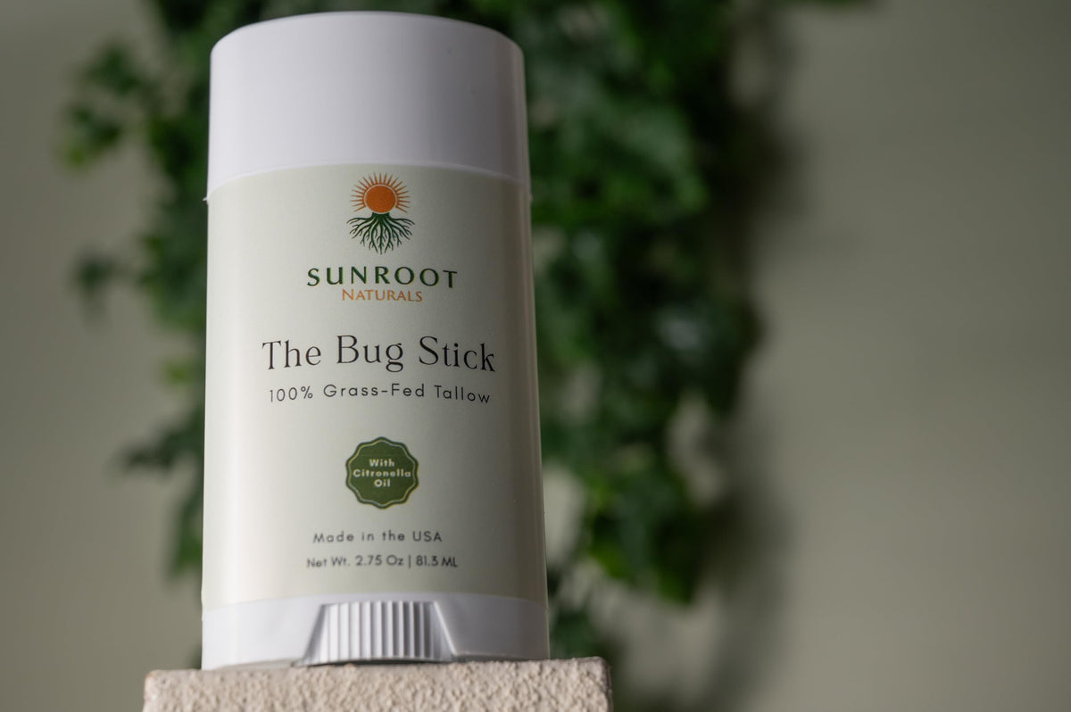 Sunroot Naturals stick held in hand to show 2.75 oz size for portable outdoor use