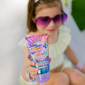 Sunshine & Glitter on swimmer showing water-resistant protection up to 80 minutes