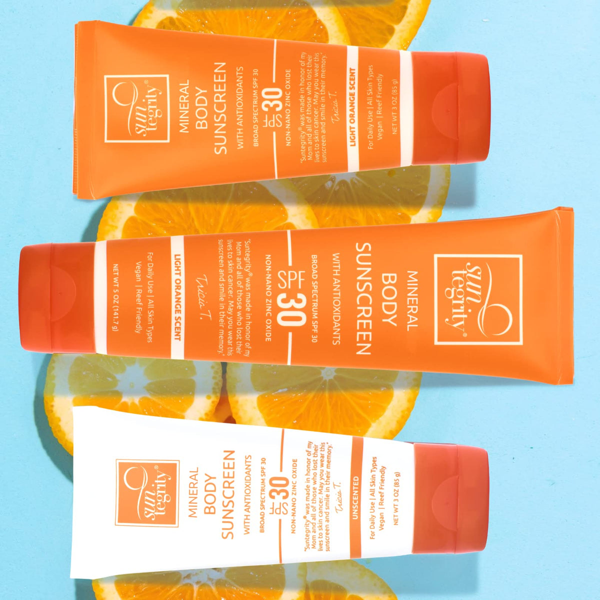 Suntegrity applying sunscreen to arm for even coverage