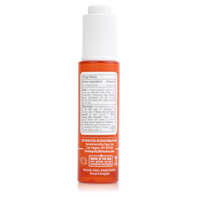Suntegrity bottle in outdoor setting showing daily sun protection on the go
