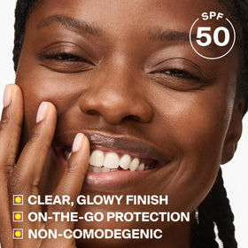 Supergoop! Glow Stick applied on cheek for quick targeted SPF protection