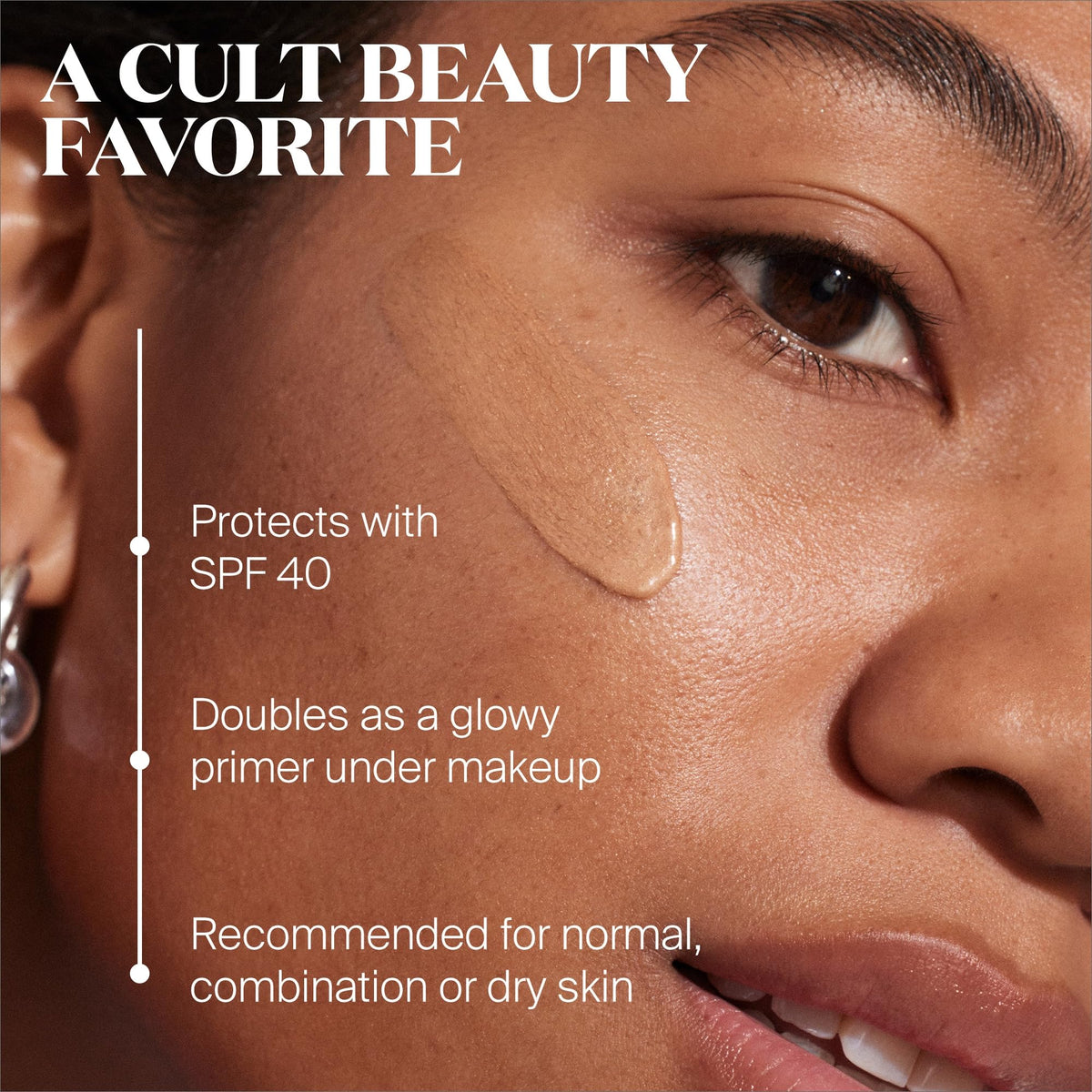 Supergoop! Glow Stick SPF 50 in hand, swipe-and-go highlight and sun protection