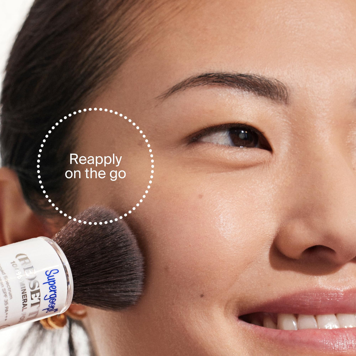 Supergoop! open cap showing soft bristles for even powder application