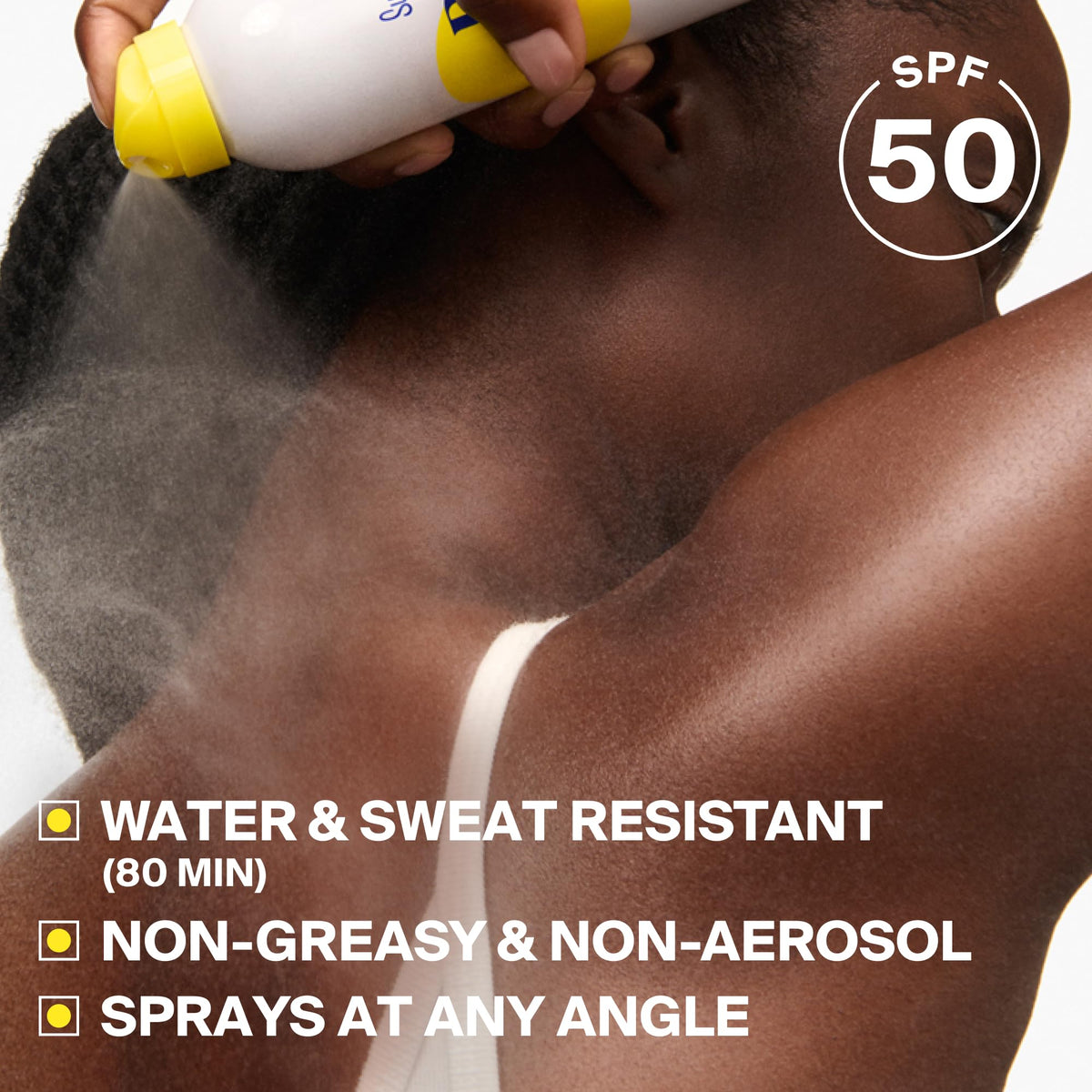 Supergoop! mist dispersing on skin for quick, even coverage