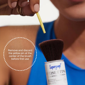 Supergoop! powder being applied over makeup for shine control benefit