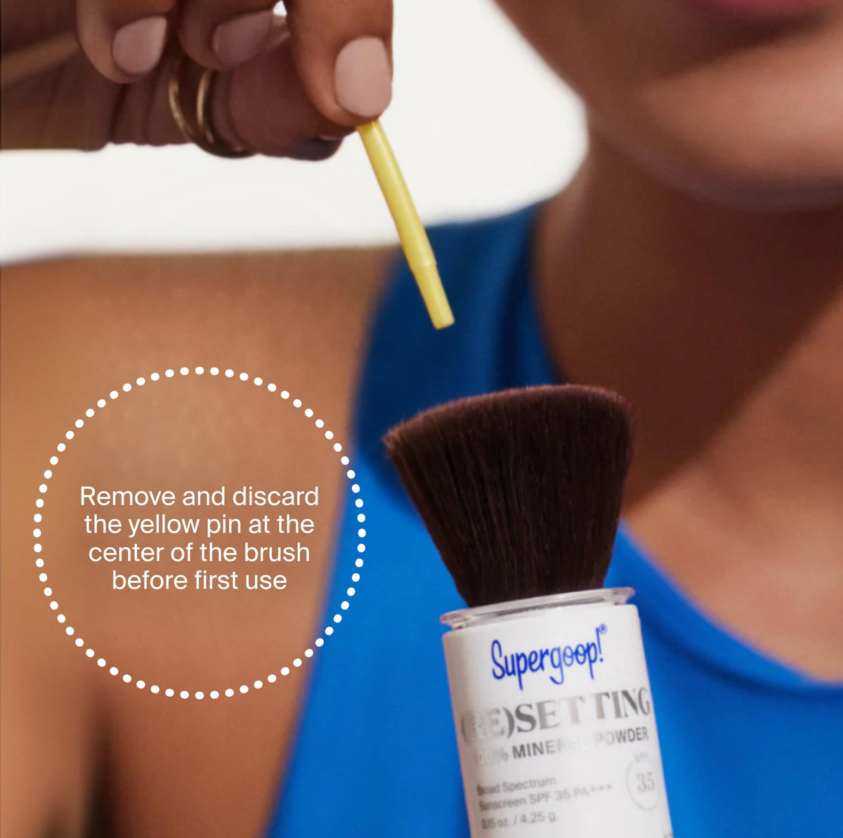 Supergoop! compact held in hand to show travel size and portability