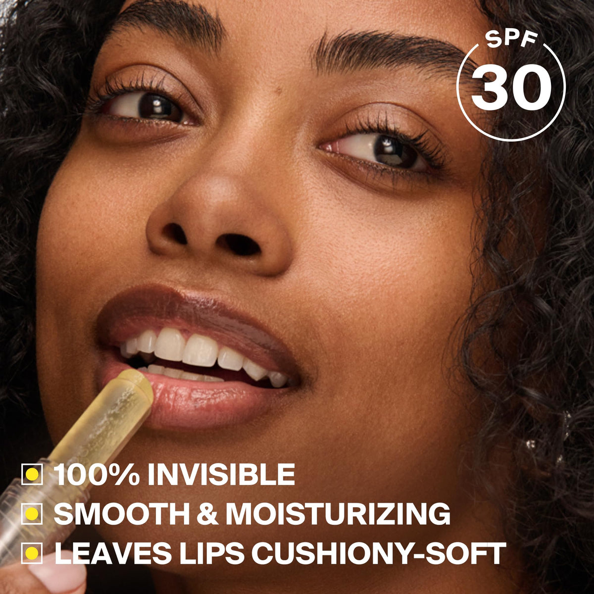 Supergoop! lip protector held in hand to show pocket-sized convenience