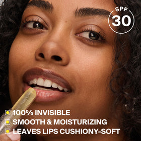Supergoop! lip protector held in hand to show pocket-sized convenience