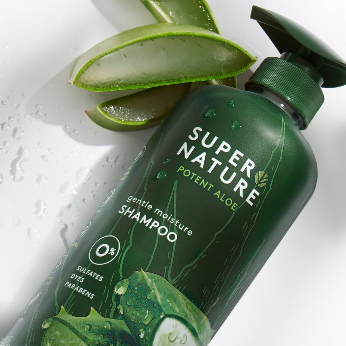 Supernature shampoo in hand beside aloe leaf, aloe hydration highlighted