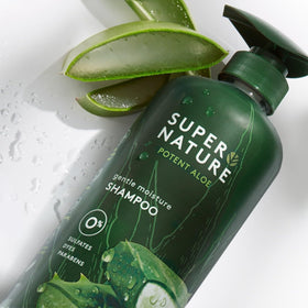 Supernature shampoo in hand beside aloe leaf, aloe hydration highlighted