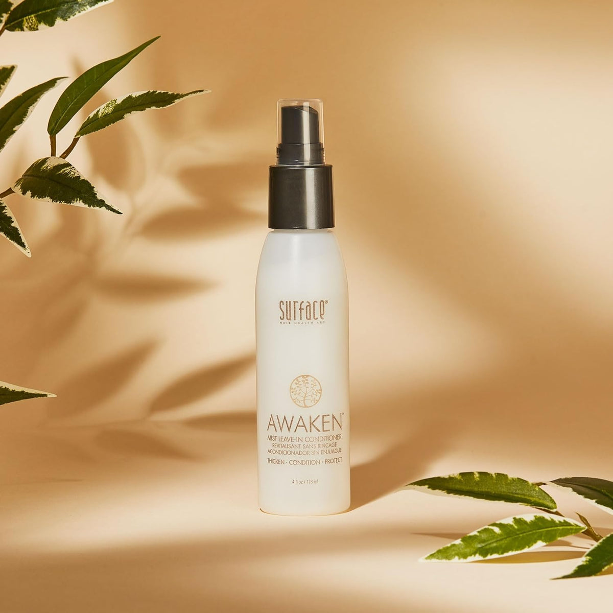 SURFACE Awaken Mist nozzle spraying fine mist demonstrating easy application and lightweight feel