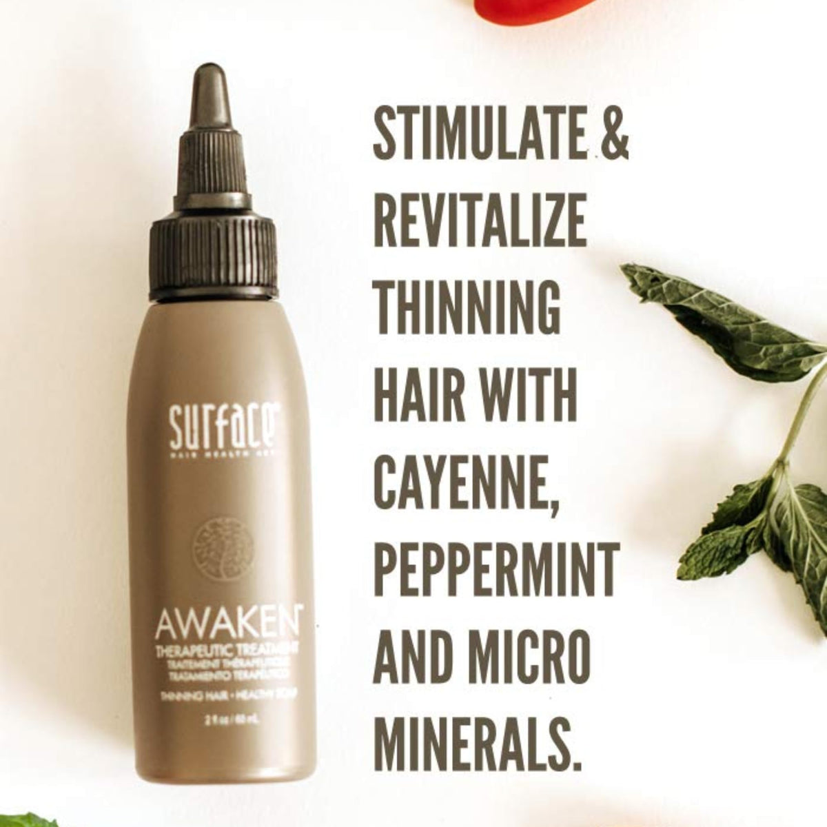 Hand applying SURFACE serum to scalp demonstrating targeted application and convenience