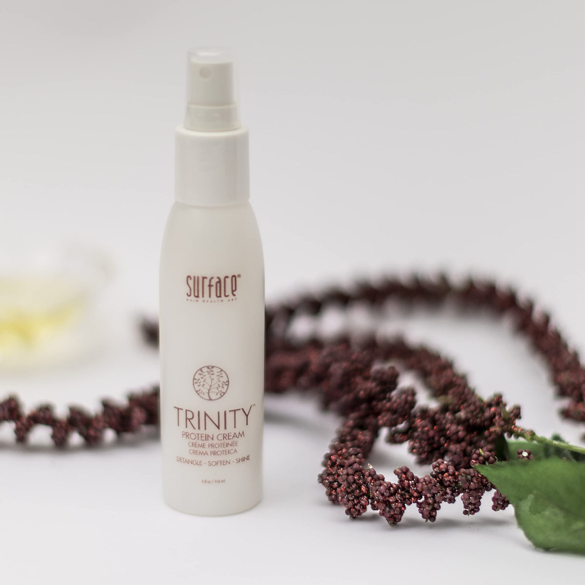 SURFACE applying Trinity Protein Cream to damp hair for detangling and shine