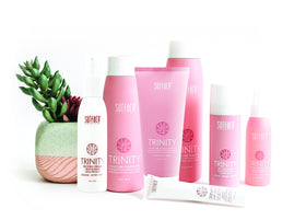 SURFACE 4 fl oz Trinity Protein Cream next to hand to show compact size