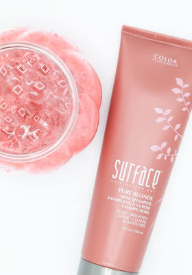 SURFACE Pure Blonde Rose shampoo lather in hand demonstrating gentle cleansing and violet pigment payoff