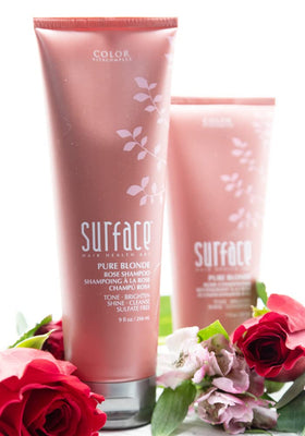 SURFACE Pure Blonde Rose 9 oz bottle beside ruler showing scale and travel-ready size benefit