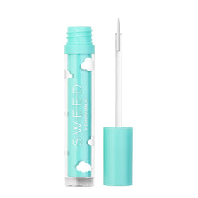 SWEED brow serum on model smiling with fuller-looking brows for natural enhancement