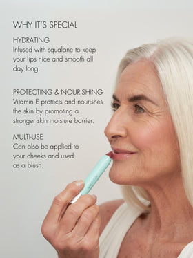Sweed lipstick held in hand to show size and scale for easy portability and on-the-go use